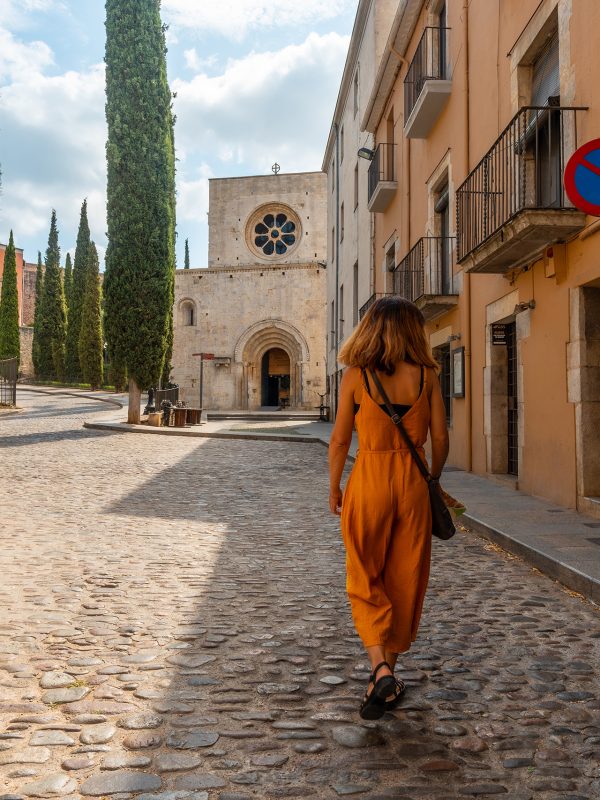Girona medieval city, a tourist in Monestir de Sant Pere de Galligants, Costa Brava of Catalonia in the Mediterranean. Spain